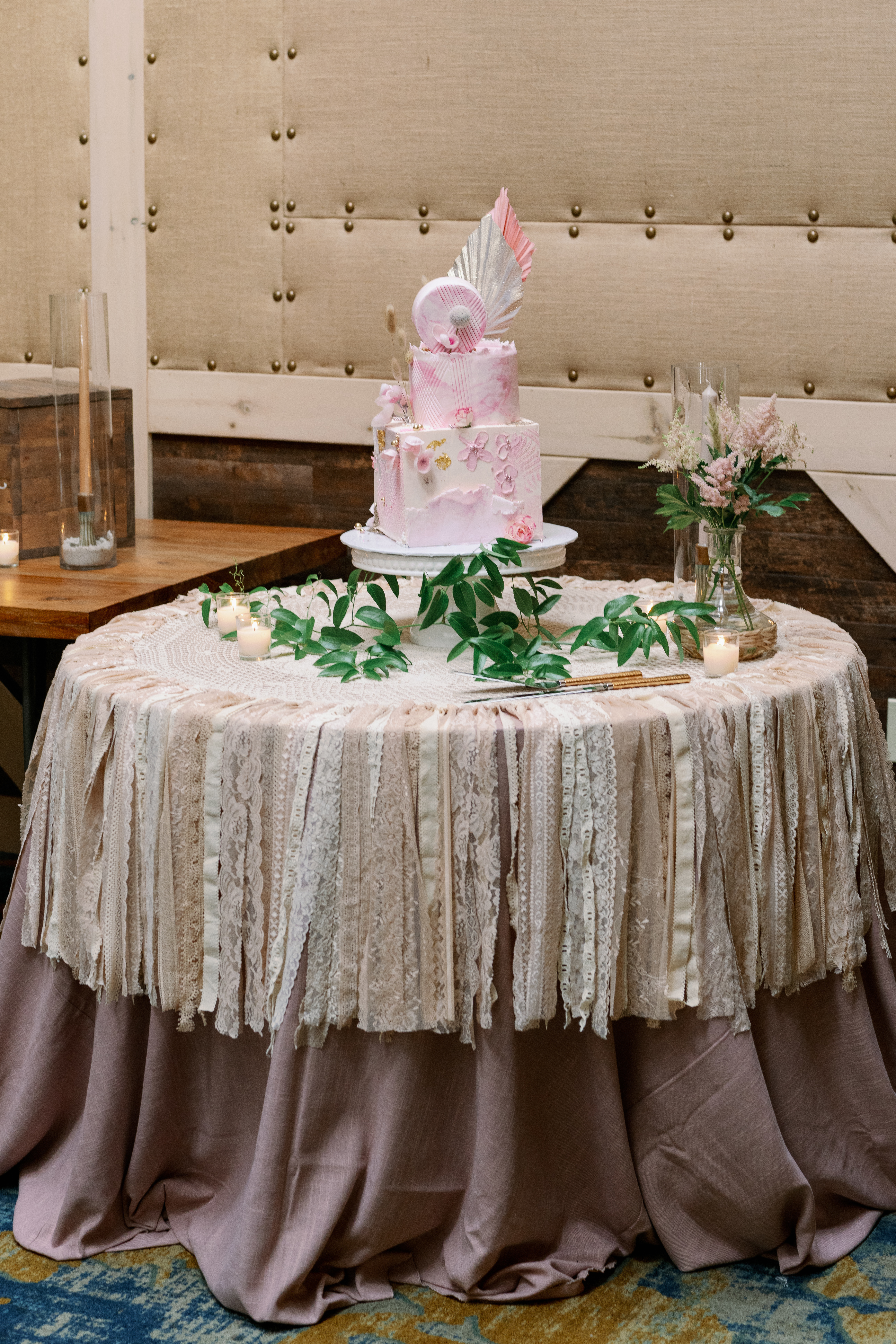 boho style table with wedding cake on top
